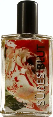 A bottle of perfume with a floral and blood-like label.