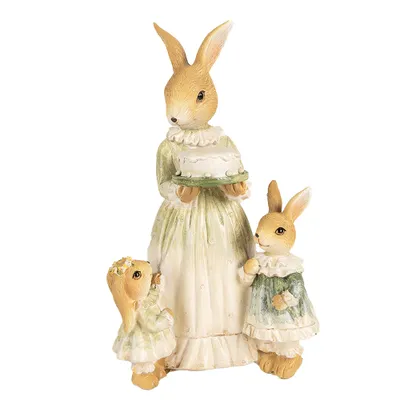 A figurine of three rabbits, with the largest rabbit in the center holding a cake.