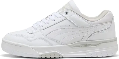 A side view of a white Puma sneaker against a white background.