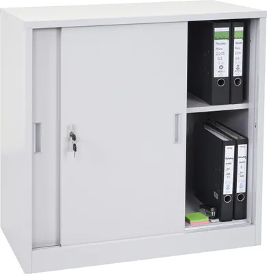 A white metal filing cabinet with sliding doors, containing several binders and some sticky notes.