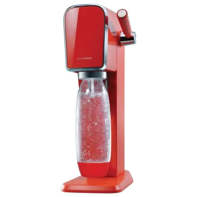 A red SodaStream Art machine with a bottle of water.