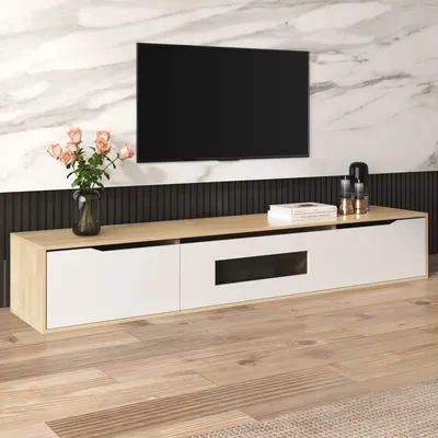 A TV stand with a television mounted above it, in a living room setting.
