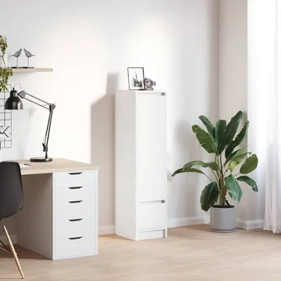 A white highboard with drawers is placed next to a desk with a lamp and a plant in a room.