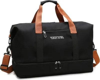 Image de Sac de sport noir avec compartiment à chaussures, idéal pour le fitness et les voyages