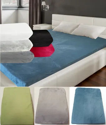 A collage of a bed with a blue fitted sheet and several folded fitted sheets in different colors.