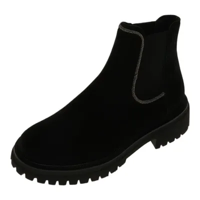 A black Chelsea boot is shown against a white background.