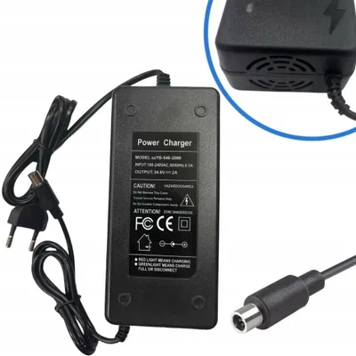 A black power charger with cables and connectors.