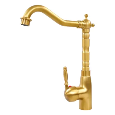 A vintage-style gold faucet on a white background.