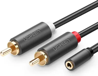 A close-up shot of a Ugreen audio cable with RCA and 3.5mm connectors.