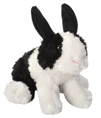 A plush toy rabbit with black and white patches sits on a white background.