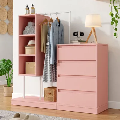 A pink wardrobe set with drawers and open storage compartments, including a clothes rail, displayed in a room setting.