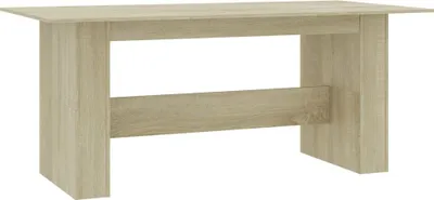 A light brown wooden dining table against a white background.