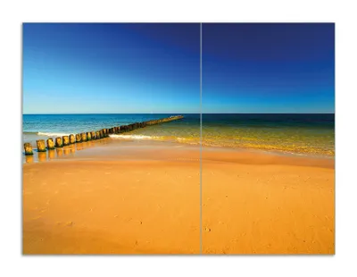 Produktbild von Wallario Herdabdeckplatte aus Glas, Größe 70 x 52 cm 2-teilig, Motiv Sandstrand in orange - Blaues Meer - Blauer Himmel