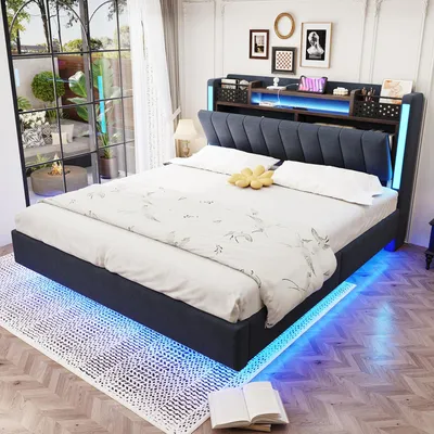 A modern bedroom with a bed featuring LED lighting.
