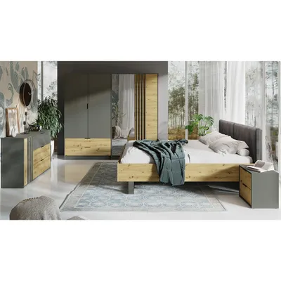 A bedroom scene with a bed, wardrobe, and dresser.