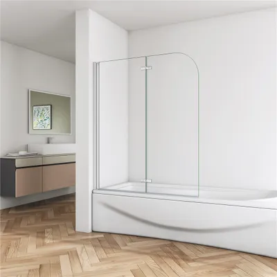 A modern bathroom with a bathtub and a glass shower screen.