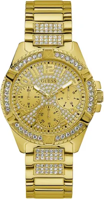 A close-up studio shot of a gold Guess watch with diamond-like embellishments.