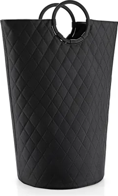 A black quilted laundry basket with round handles.