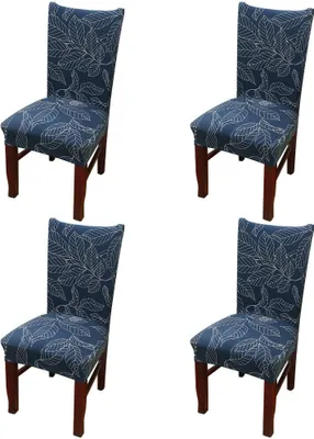 Four dining chairs with blue leaf-patterned slipcovers and brown wooden legs, arranged in a grid on a white background.