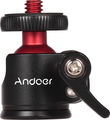 A close-up studio shot of a black and red mini ball head tripod mount.