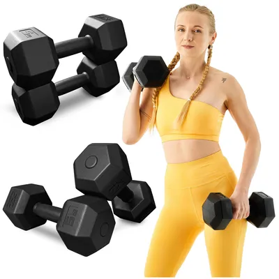 A woman in athletic wear holding dumbbells, with additional dumbbells shown in the foreground and background.