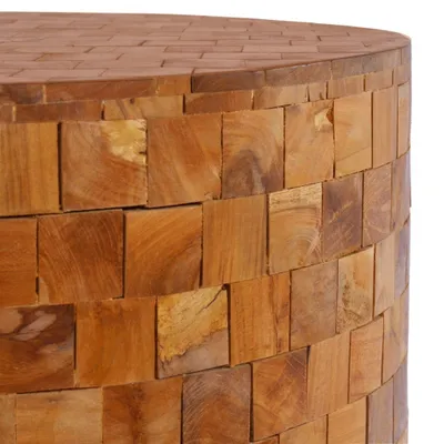 Close-up of a round wooden coffee table made of small square wood blocks.