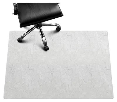 A black office chair with chrome legs is positioned on a light gray floor mat with a marble texture.