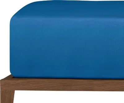 A close-up view of a blue fitted sheet on a wooden bed frame.