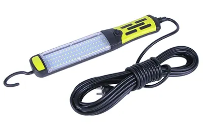 A work light with a cord on a white background.