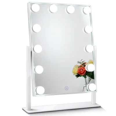 A white LED makeup mirror with lights is shown on a white background. A small bouquet of flowers is reflected in the mirror.