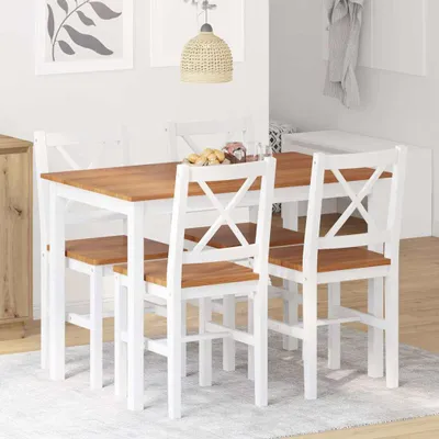 A dining set with a table and four chairs in a room.