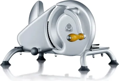 A silver meat slicer on a white background.