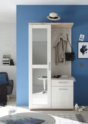 A hallway or entryway with a compact wardrobe unit.