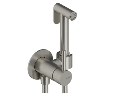 A close-up studio shot of a brushed nickel bidet spray set mounted on a wall.