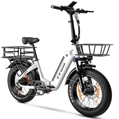 A white electric fat tire bicycle with front and rear baskets is shown against a white background.
