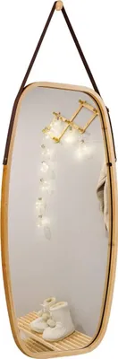 A mirror with a wooden frame and leather strap, decorated with fairy lights and a small shelf holding slippers.