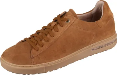 A single brown suede sneaker is shown against a white background.