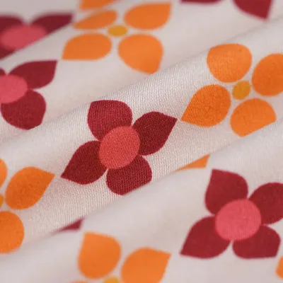 Imagen del producto de Tejido de satén, viscosa, estampado floral geométrico, color rosa