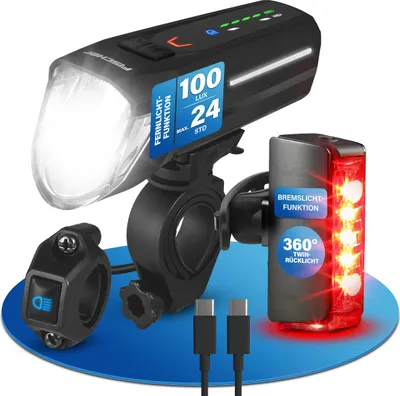 A product shot of a bicycle light set on a blue circular mat.