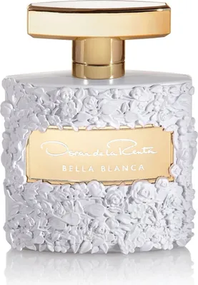 A perfume bottle with a white floral design and a gold cap and label.