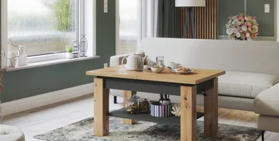 A living room scene with a coffee table in the foreground and a sofa in the background.