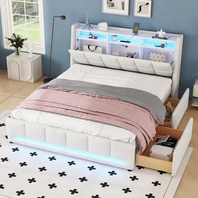 A bedroom scene featuring a white upholstered bed with integrated storage and LED lighting.