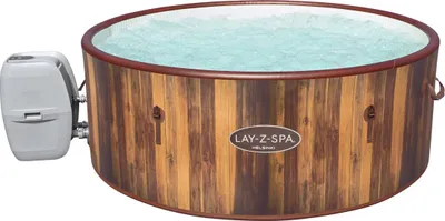 A Lay-Z-Spa whirlpool with a wood-like exterior and a pump attached to the side.