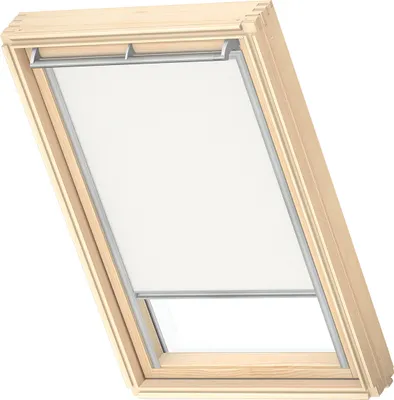 A wooden framed skylight window with a white roller blind.