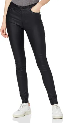 A person wearing black skinny jeans and white sneakers, shown from the waist down against a white background.