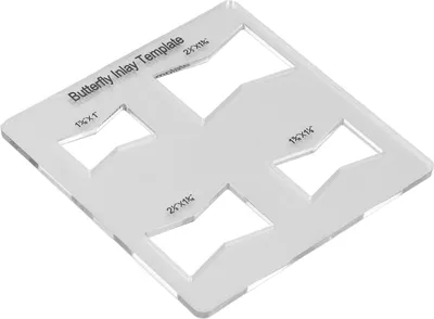 A clear acrylic template for creating butterfly inlays in woodworking.
