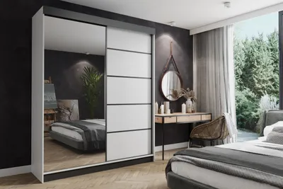 A bedroom scene with a wardrobe, dressing table, and bed.