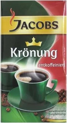 A package of Jacobs Krönung decaffeinated ground coffee, featuring images of coffee cups and beans.