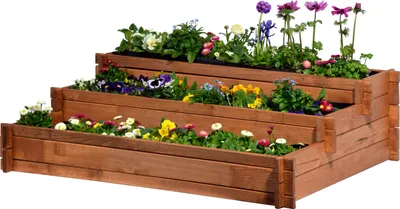 A tiered wooden planter box filled with various colorful flowers against a white background.
