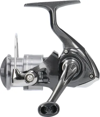 A studio shot of a fishing reel against a white background.